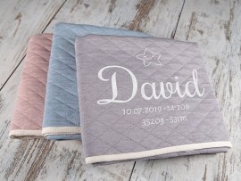 Embroidered baby blankets in three soft pastel-colours